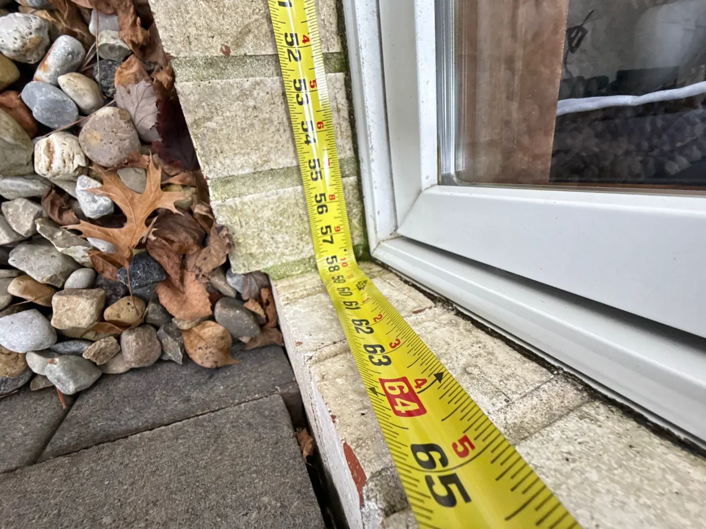 Storm-damaged window documented in Sandstone Lakes